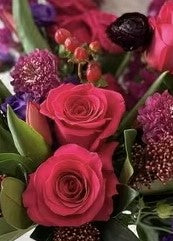 Red roses with greenery.