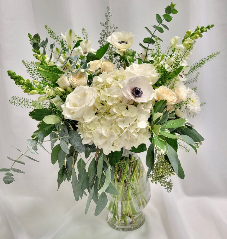 White and green floral arrangement.