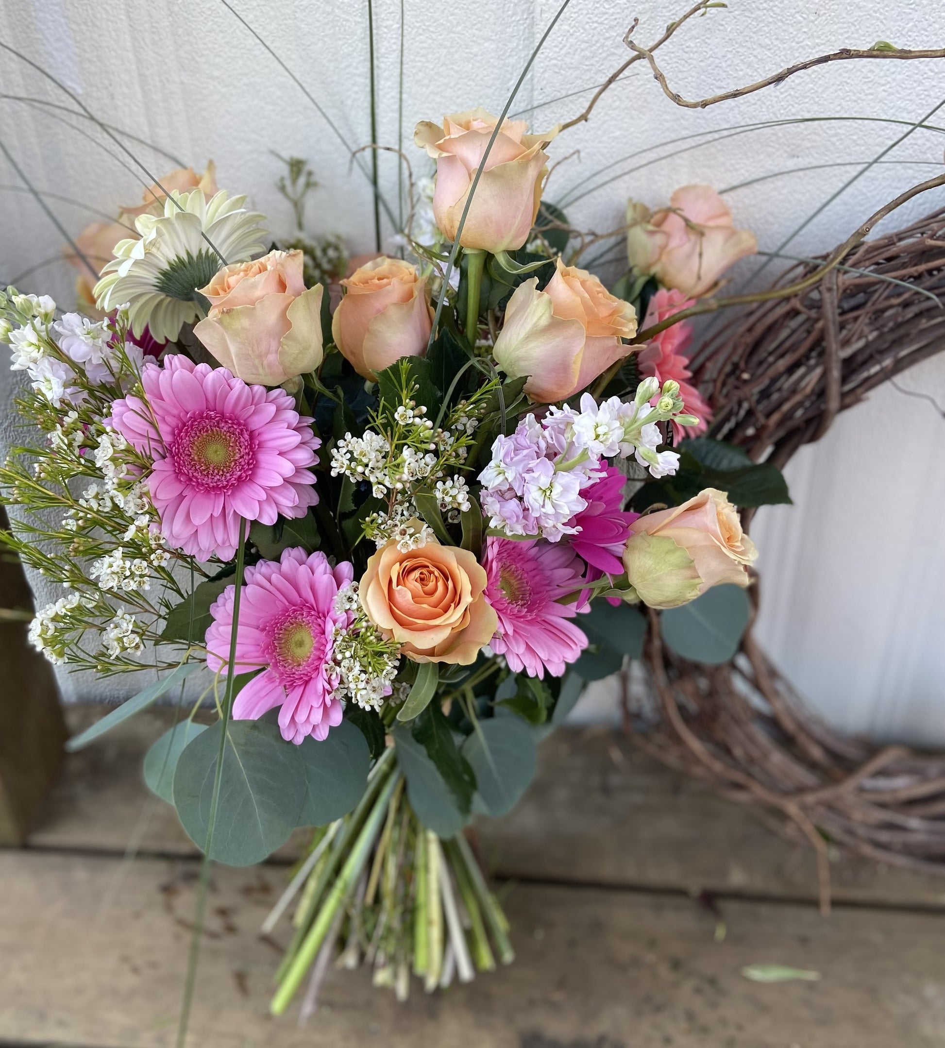 Flower bouquet with different shades of pink flowers.