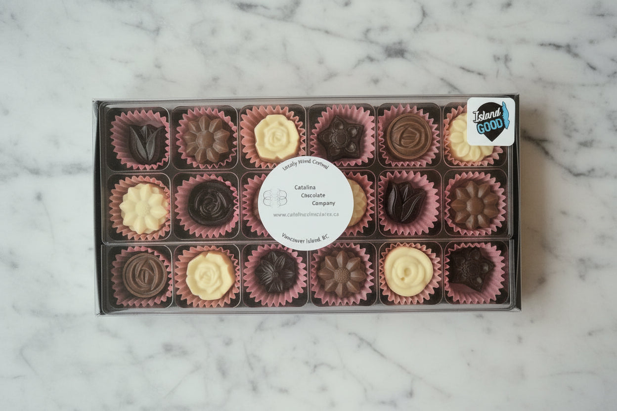 A 16 piece box of milk, white and dark chocolate flowers.  